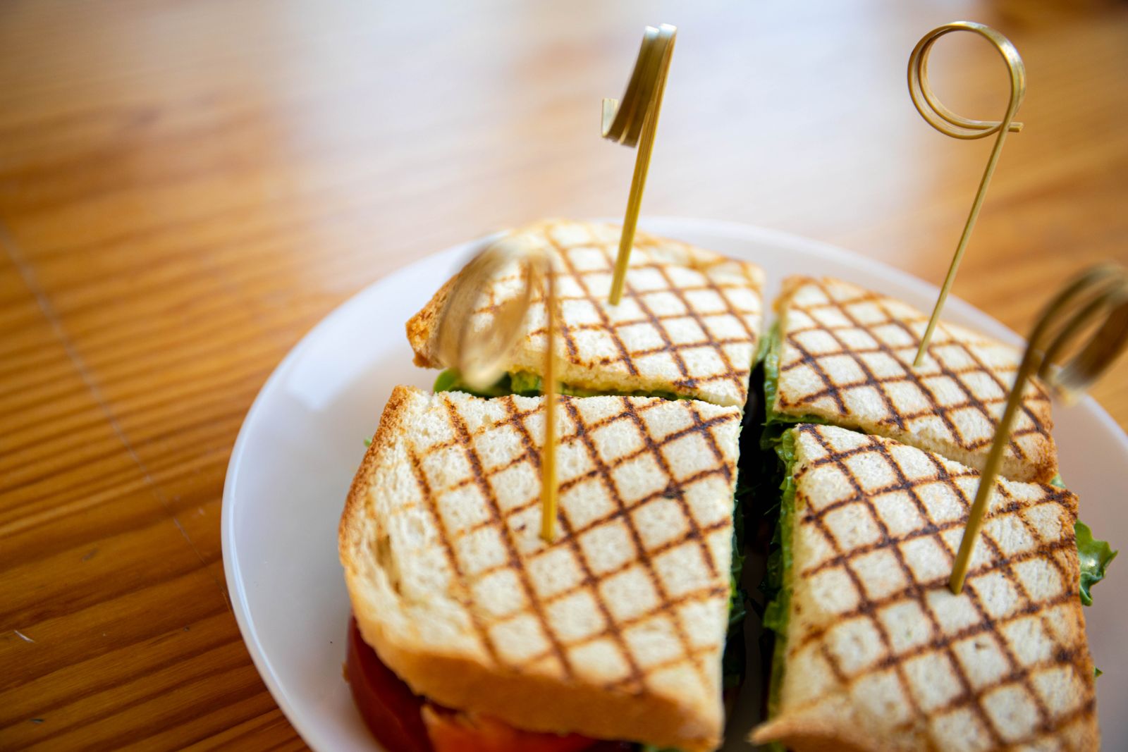 a toasted sandwich cut into portions.